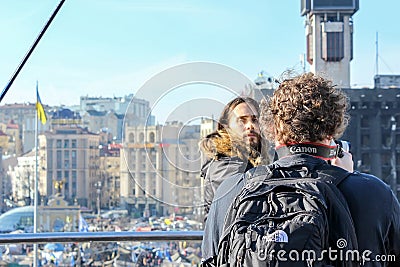 Jared Leto looks back, and his cameraman takes pictures of the tent city standing over the Maidan Nezalezhnosti Editorial Stock Photo