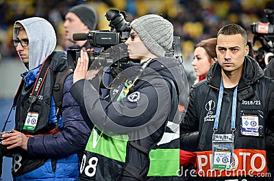 Kiev, UKRAINE - March 14, 2019: Journalists and photographers work and take photos during the UEFA Europa League match between Editorial Stock Photo