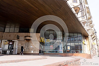 Kiev, Ukraine, March 27, 2020, young fashion girl goes near mcdonald Editorial Stock Photo