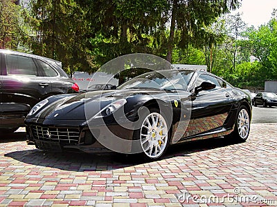 Kiev, Ukraine - May 14, 2011: Black supercar Ferrari 599 Fiorano in the city Editorial Stock Photo