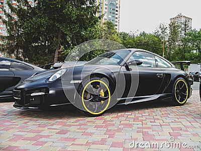 Kiev, Ukraine - May 14, 2011: Black supercar Porsche 911 997 Turbo TechArt GT Street in the city Editorial Stock Photo