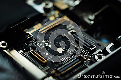 Kiev, Ukraine - May 6, 2019: Close-up image of the central board of the apple iphone se. Golden Apple. Service repair Editorial Stock Photo