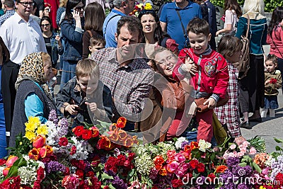 Kiev, Ukraine - May 9, 2015: Kyivans laid flowers to the monument to the fallen soldiers Editorial Stock Photo