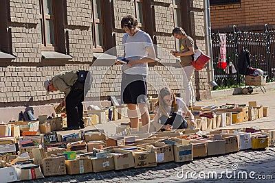 Kiev, Ukraine - May 19, 2019: Peoples buy old books at a flea market on Andreevsky Spusk Editorial Stock Photo