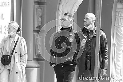 Kiev, Ukraine - May, 28, 2020: Several people are surprised at the long line near the bank. Editorial Stock Photo