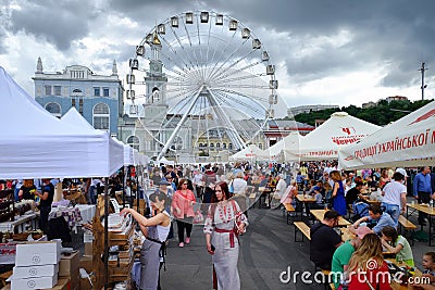 KIEV, UKRAINE - MAY 19, 2018: The traditional street fair of a variety of natural organic products. Ferris wheel Editorial Stock Photo