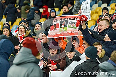 KIEV, UKRAINE - November 29, 2018: Fans and ultras of FC Arsenal with poster support the team during the UEFA Europa League match Editorial Stock Photo