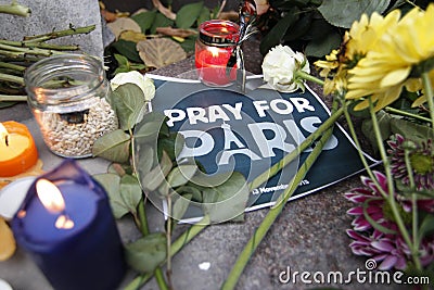 KIEV,UKRAINE - November 14, 2015: People lay flowers at the French Embassy in Kiev in memory of the victims terror attacks in Pari Editorial Stock Photo