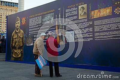 Kiev, Ukraine - October 14, 2018: Elderly people consider historical materials on the Maidan Nezalezhnosti Editorial Stock Photo