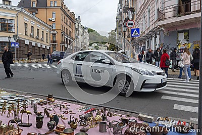 Kiev, Ukraine - 01 October, 2017: Taxi service on the Andreevsky Uzvizh street Editorial Stock Photo