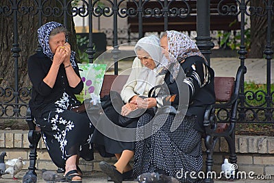 Old women sit on bench park, Editorial Stock Photo