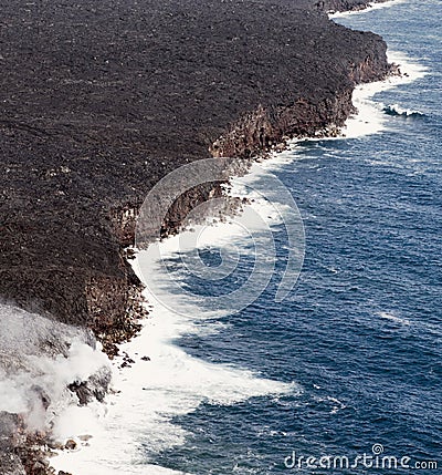 Kilauea lava enters the ocean, expanding coastline. Stock Photo