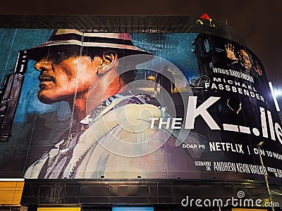 The Killer Netflix movie poster with Michael Fassbender directed by David Fincher giant street banner with Romanian titles in Editorial Stock Photo