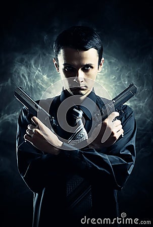 Killer with two pistols Stock Photo