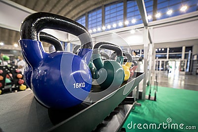 16 kilogram Kettlebells for exercise placed on shelf in gym Stock Photo