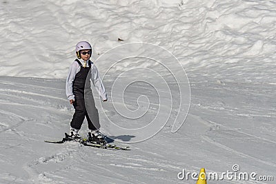 KIMBERLEY, CANADA - MARCH 22, 2019: Mountain Resort view early spring child skiing Editorial Stock Photo
