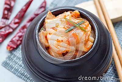 Kimchi cabbage. Korean appetizer in ceramic jar, horizontal, closeup Stock Photo