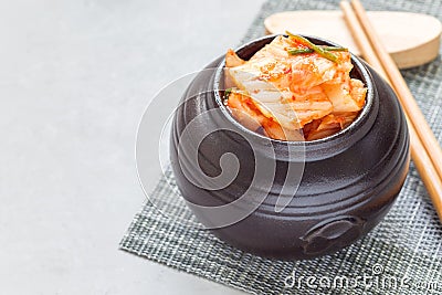 Kimchi cabbage. Korean appetizer in ceramic jar, horizontal, copy space Stock Photo