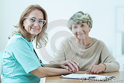 Kind female medic with patient Stock Photo