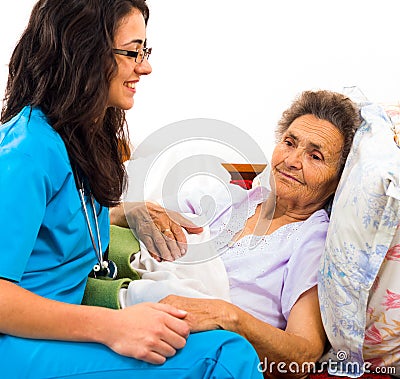 Kind Nurse with Elderly Stock Photo