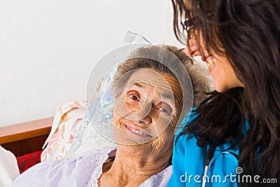 Kind Nurse with Elderly Stock Photo