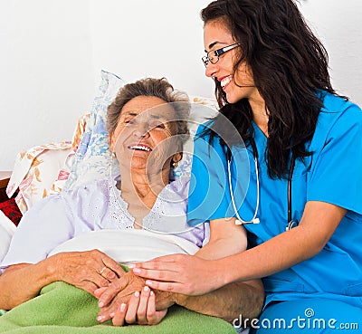 Kind Nurse with Elderly Stock Photo