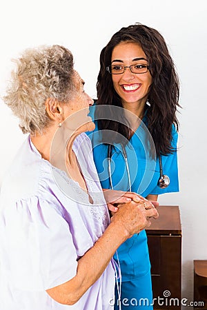 Kind Nurse with Elderly Stock Photo