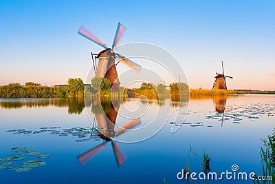 Kinderdijk National Park in the Netherlands. Windmills at dusk. A natural landscape in a historic location. Reflections on the wat Stock Photo