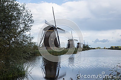 Kinderdijk, The Netherlands, May 30th, 2018 - Windmills at Kinderdijk at sunset. Kinderdijk, South Holland, Netherlands Editorial Stock Photo