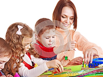 Kindergarden teacher with children. Stock Photo
