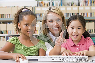 Kindergarten teacher sitting with children Stock Photo