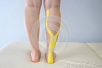 Kinesiotaping Medicine Rehabilitation on a woman Stock Photo