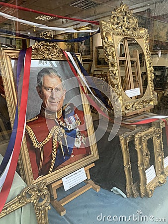 King Charles III coronation in May 2023 is celebrated in London in an antique frames shop Editorial Stock Photo