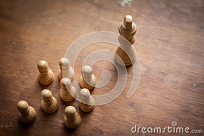 King, Chief and Leader. Followers on social media concept. Chess pieces on a wooden background Stock Photo