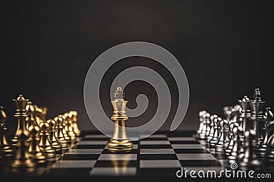 King golden chess standing confront of the silver chess team to challenge Stock Photo