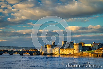 The King John Castle over the Shannon river in Limerick at sunset, Ireland Stock Photo
