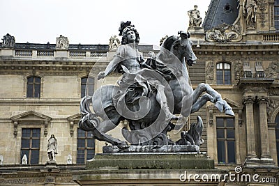 King Louis XIV Statue at Cour Napoleon the entrance to the Musee du Louvre Editorial Stock Photo