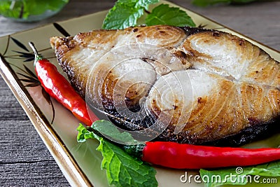 King mackerel steak on wood background,fried fish Stock Photo