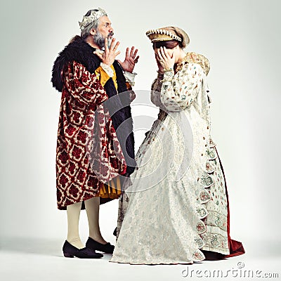 King man, queen and argue in studio with anger, frustrated and crying in relationship, theater and drama. Medieval royal Stock Photo