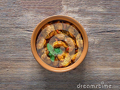 King Prawn Masala in a clay bowl. Traditional Indian cuisine Stock Photo
