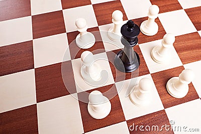King surrounded by pawns Stock Photo