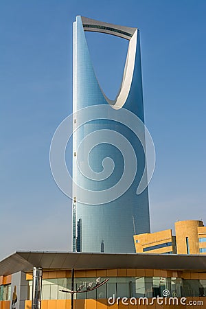 Kingdom Center tower or Burj Al Mamlaka glows a blue color again blue sky Stock Photo