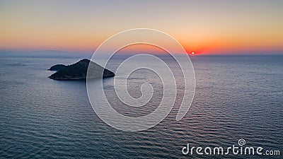 Kinira island in sunrise, Greece Stock Photo