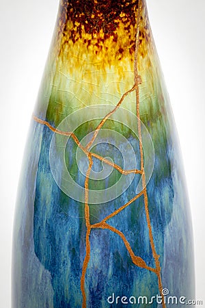 A kintsugi repaired vase with gold. Stock Photo