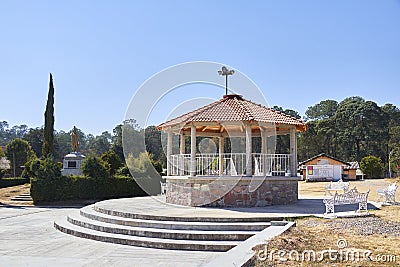 Kiosk and village benches during a sunny day Editorial Stock Photo