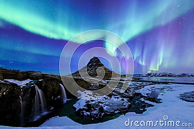Kirkjufell and Aurora in Iceland. Stock Photo