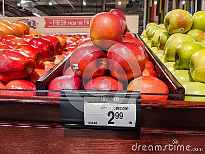 Cosmic Crisp hybrid apples for sale in the produce section inside a QFC grocery store Editorial Stock Photo
