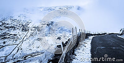 Kirkstone Pass With Snow And Fog. Stock Photo