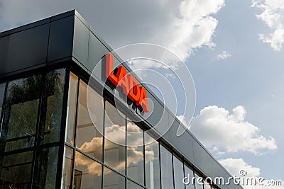 Kirov, Russia - August 2021: LADA logo on the exhibition hall building on a sunny day. The brand of cars produced by Editorial Stock Photo