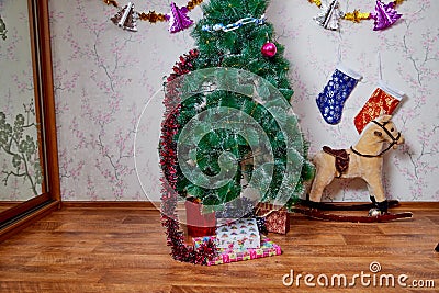 Kirov, Russia - December 17, 2018: Beautiful Christmas tree in living room decorated for Christmas. Place for photoshoot Stock Photo